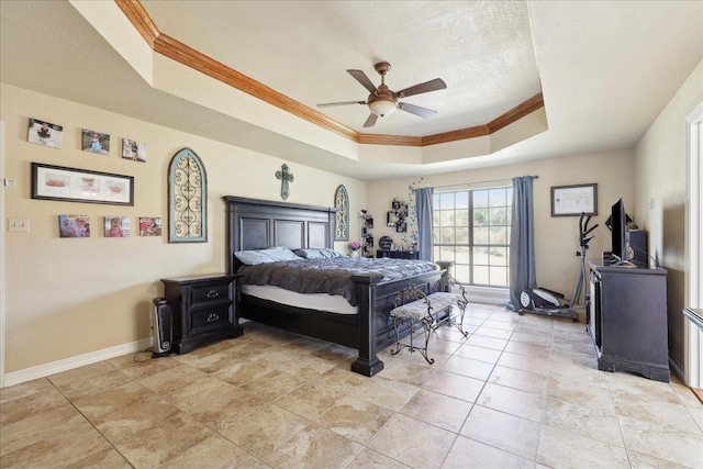 bedroom featuring crown molding, ceiling fan, a raised ceiling, and a textured ceiling