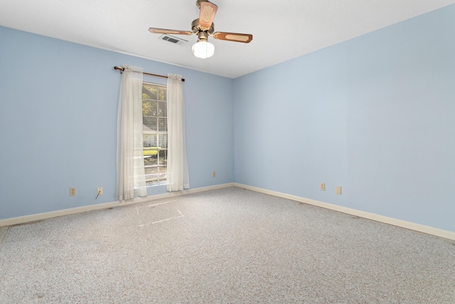 unfurnished room with carpet flooring and ceiling fan