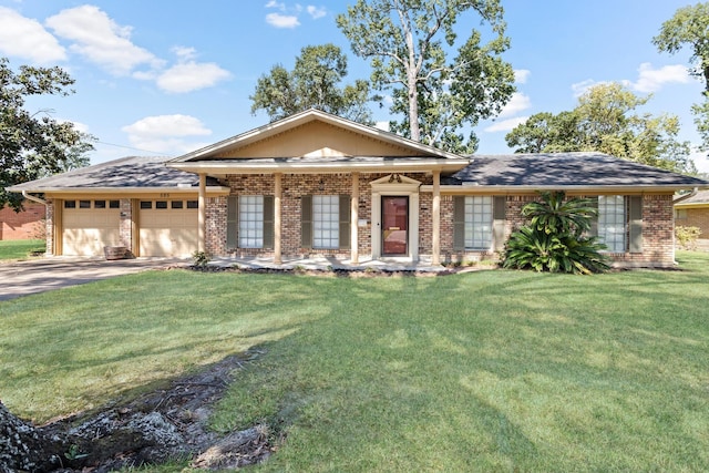 view of front of house with a front yard and a garage