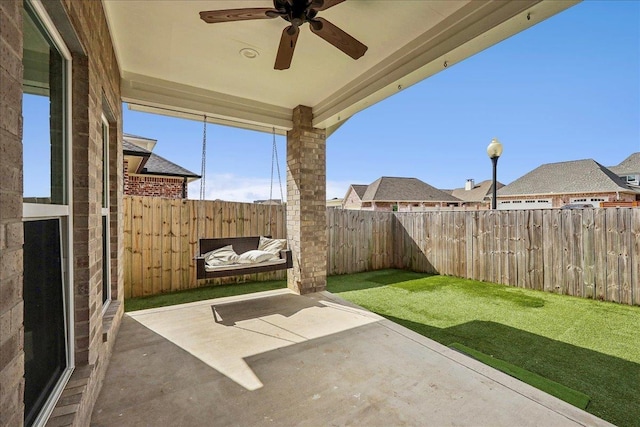 view of patio featuring a fenced backyard and ceiling fan