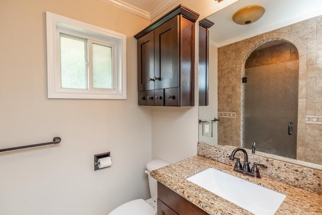 bathroom with vanity, toilet, and crown molding