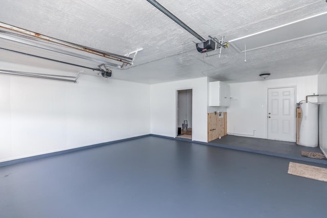 garage with a garage door opener and water heater