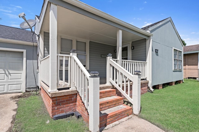3140 S Drive Drive, Groves, TX 77619 - doorway to property featuring a lawn and covered porch
