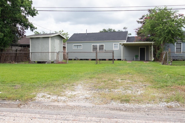 back of house with a lawn