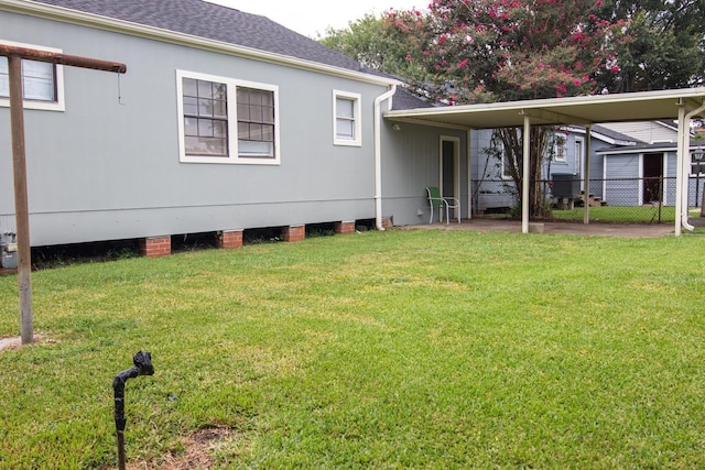 back of house featuring a yard