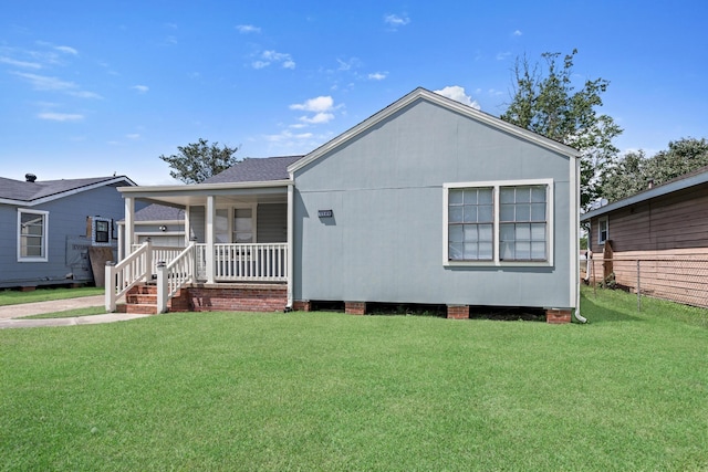 3140 S Drive Drive, Groves, TX 77619 - view of front of house featuring covered porch and a front lawn