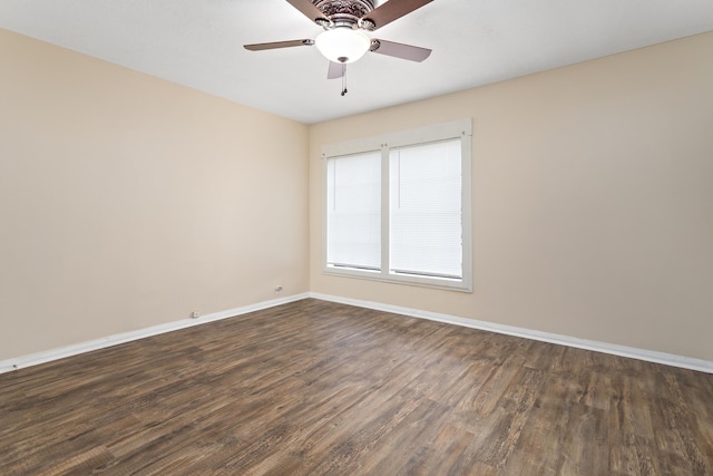 3140 S Drive Drive, Groves, TX 77619 - spare room with dark wood finished floors, baseboards, and ceiling fan