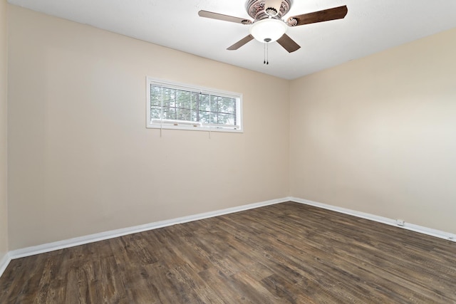 3140 S Drive Drive, Groves, TX 77619 - empty room featuring dark wood-style floors, baseboards, and a ceiling fan