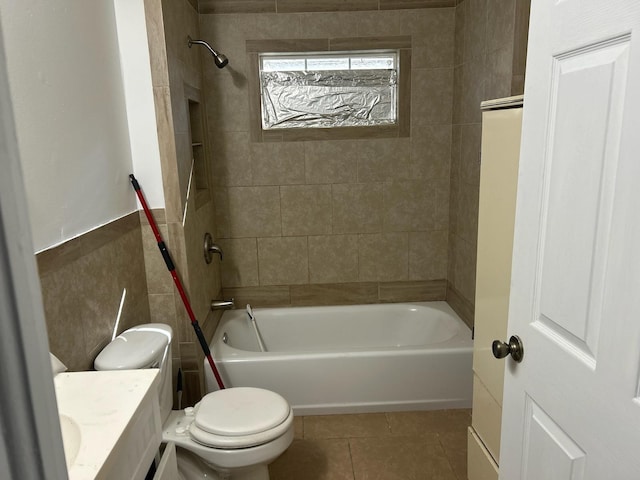 full bathroom with tile patterned flooring, vanity, toilet, and tiled shower / bath combo