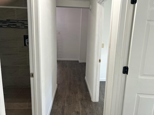 corridor featuring dark hardwood / wood-style floors