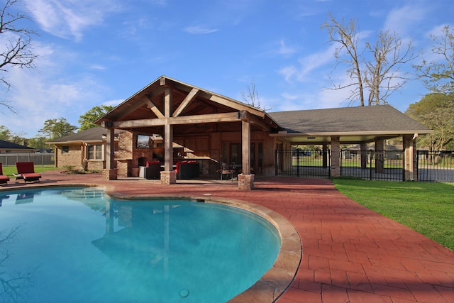 view of pool featuring a patio area, fence, and a fenced in pool