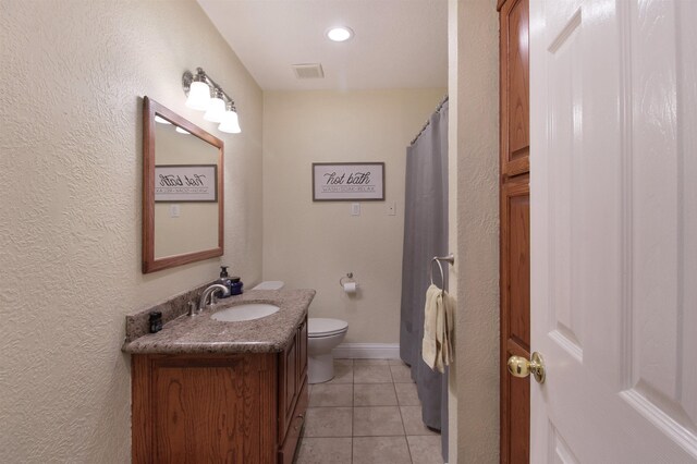 full bath featuring visible vents, toilet, vanity, tile patterned flooring, and baseboards