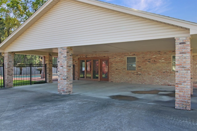 exterior space with driveway and fence