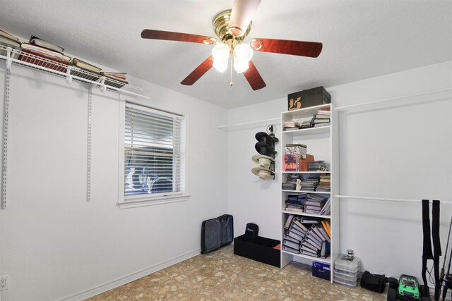 interior space with a ceiling fan