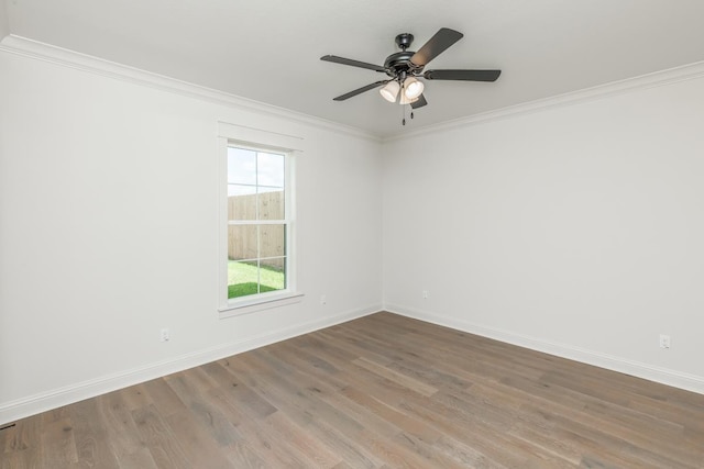 unfurnished room featuring hardwood / wood-style flooring, ornamental molding, and ceiling fan