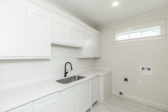 clothes washing area featuring sink, cabinets, hookup for a washing machine, crown molding, and hookup for an electric dryer