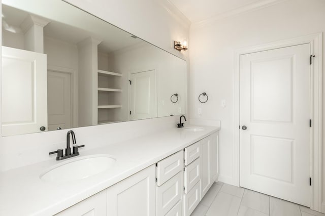 bathroom with vanity and ornamental molding