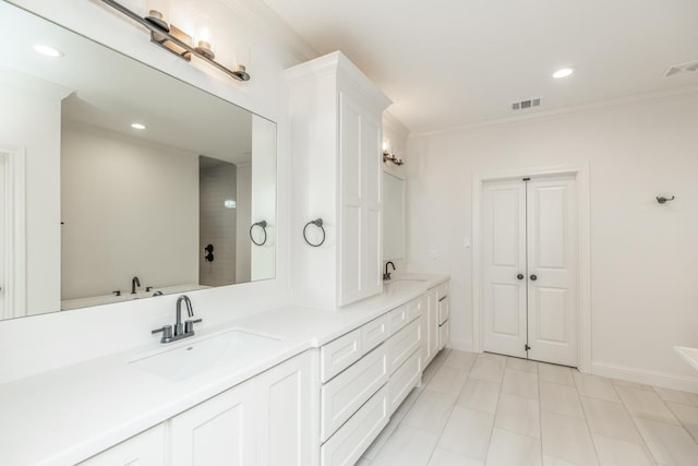 bathroom with vanity and crown molding