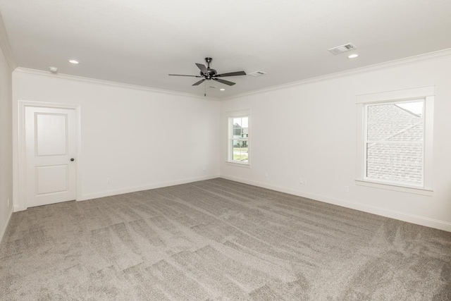 spare room with light carpet and ornamental molding