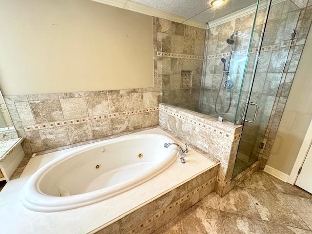 6845 Hialeah Dr, Beaumont, TX 77706 - full bathroom with a jetted tub and a stall shower