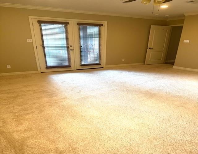 6845 Hialeah Dr, Beaumont, TX 77706 - spare room featuring crown molding, ceiling fan, baseboards, and light carpet