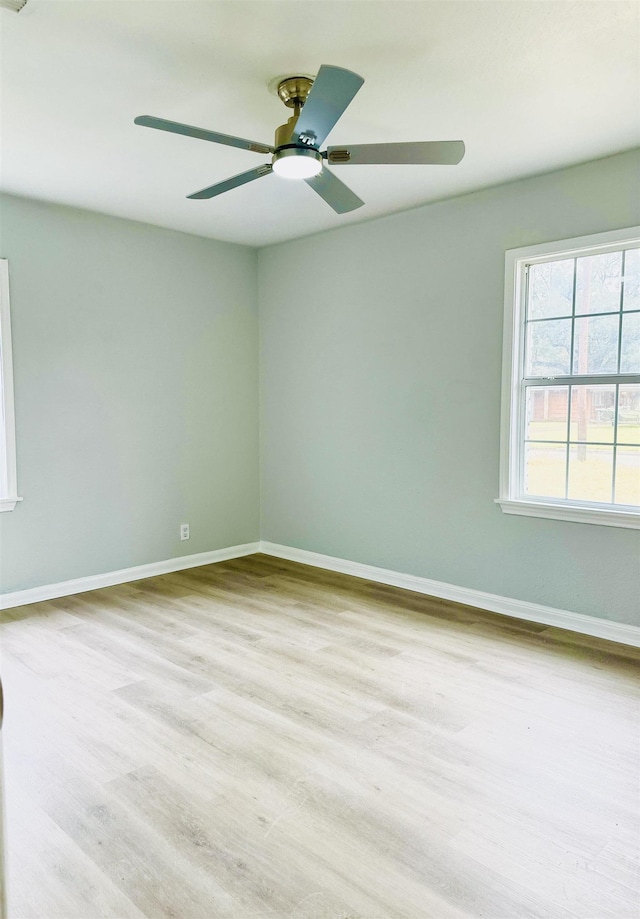 empty room featuring ceiling fan and light wood-type flooring