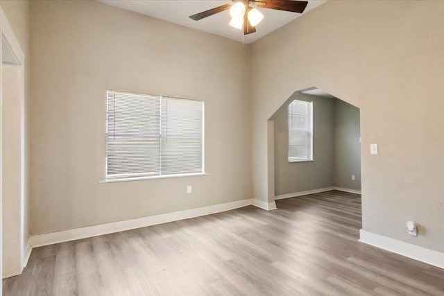 spare room featuring hardwood / wood-style floors and ceiling fan