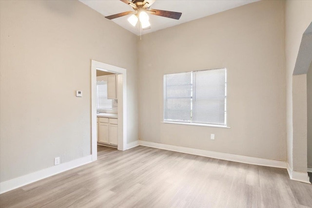 empty room featuring ceiling fan and light hardwood / wood-style floors