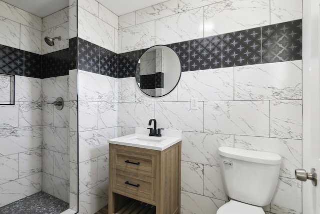 bathroom featuring toilet, a shower, and vanity