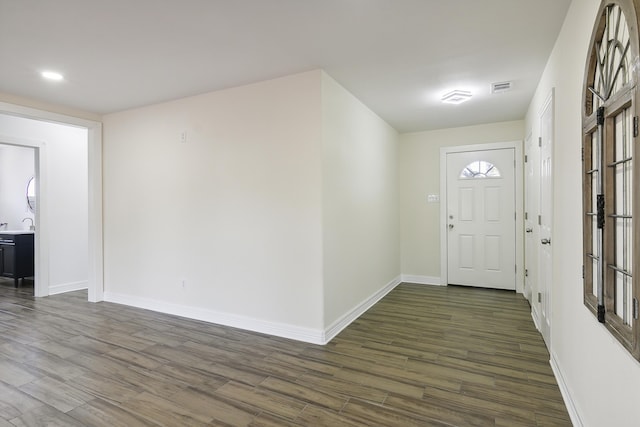 foyer entrance with dark hardwood / wood-style flooring