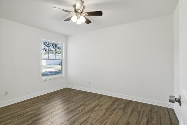 unfurnished room with ceiling fan and dark hardwood / wood-style floors