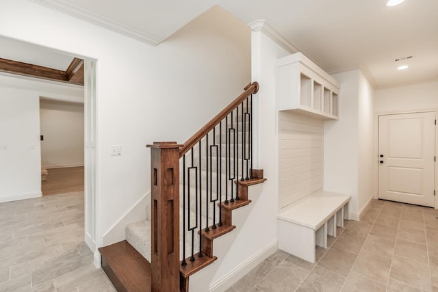 mudroom featuring ornamental molding