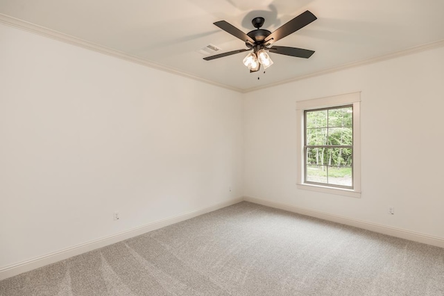 carpeted empty room with crown molding and ceiling fan