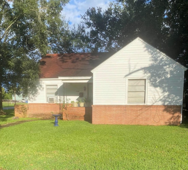 view of home's exterior with a yard