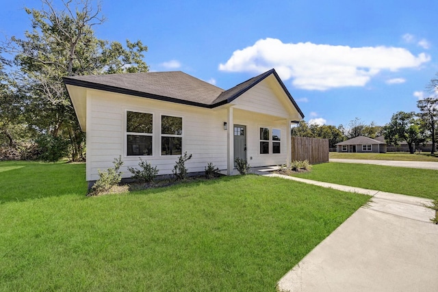 view of front of home with a front lawn