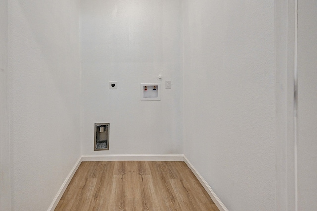 washroom featuring hookup for an electric dryer, hookup for a washing machine, and hardwood / wood-style flooring