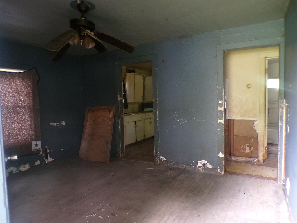 260 S 7th, Silsbee, TX 77656 - unfurnished bedroom with hardwood / wood-style floors