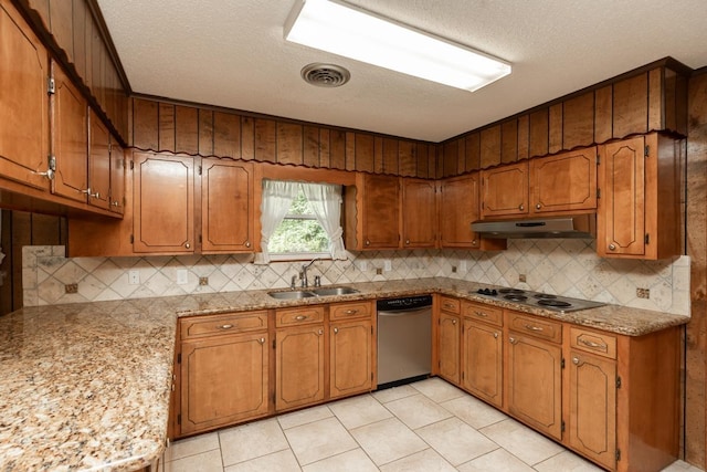 190 Magnolia Trl, Lumberton, TX 77657 - kitchen featuring dishwasher, a textured ceiling, under cabinet range hood, tasteful backsplash, and brown cabinetry