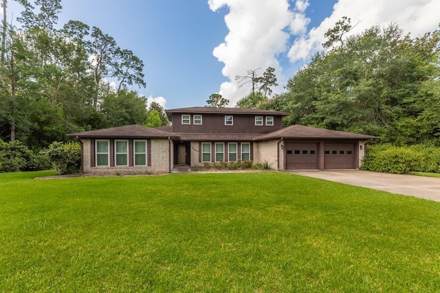 190 Magnolia Trl, Lumberton, TX 77657 - view of front facade with an attached garage, driveway, a front yard, and brick siding