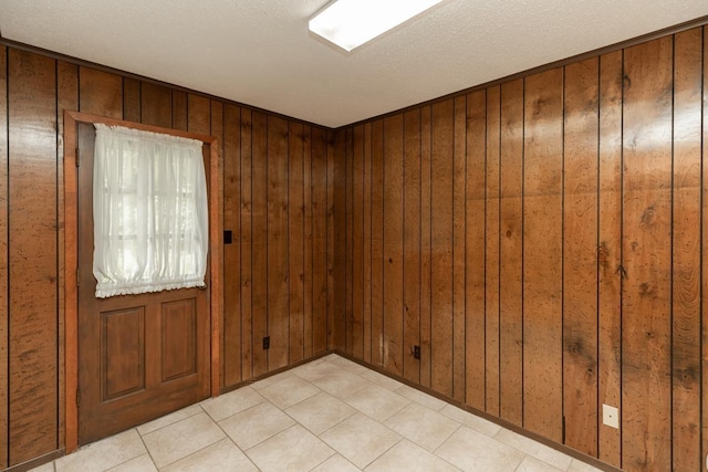 190 Magnolia Trl, Lumberton, TX 77657 - spare room with wooden walls and light tile patterned floors