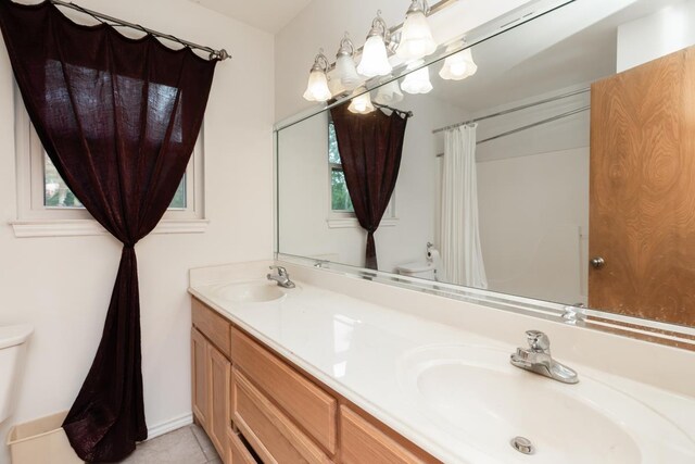 190 Magnolia Trl, Lumberton, TX 77657 - bathroom with double vanity, a shower with shower curtain, and tile patterned floors