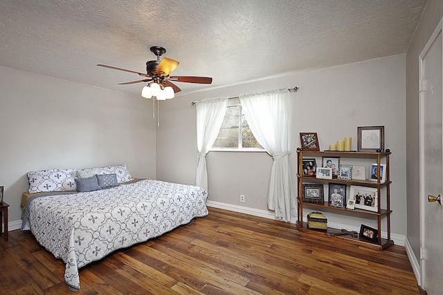 11 Finwick Dr, Orange, TX 77632 - bedroom featuring ceiling fan, a textured ceiling, baseboards, and hardwood / wood-style floors