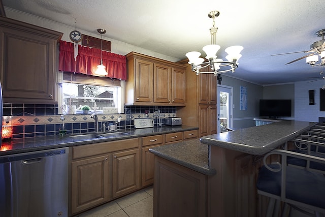 11 Finwick Dr, Orange, TX 77632 - kitchen featuring ornamental molding, dark countertops, dishwasher, and a sink