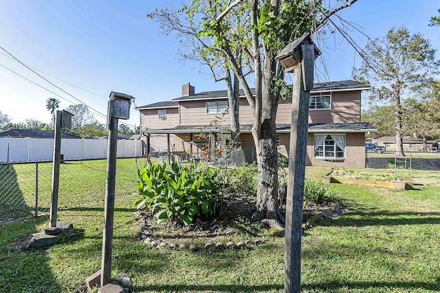 11 Finwick Dr, Orange, TX 77632 - view of yard featuring fence and a vegetable garden