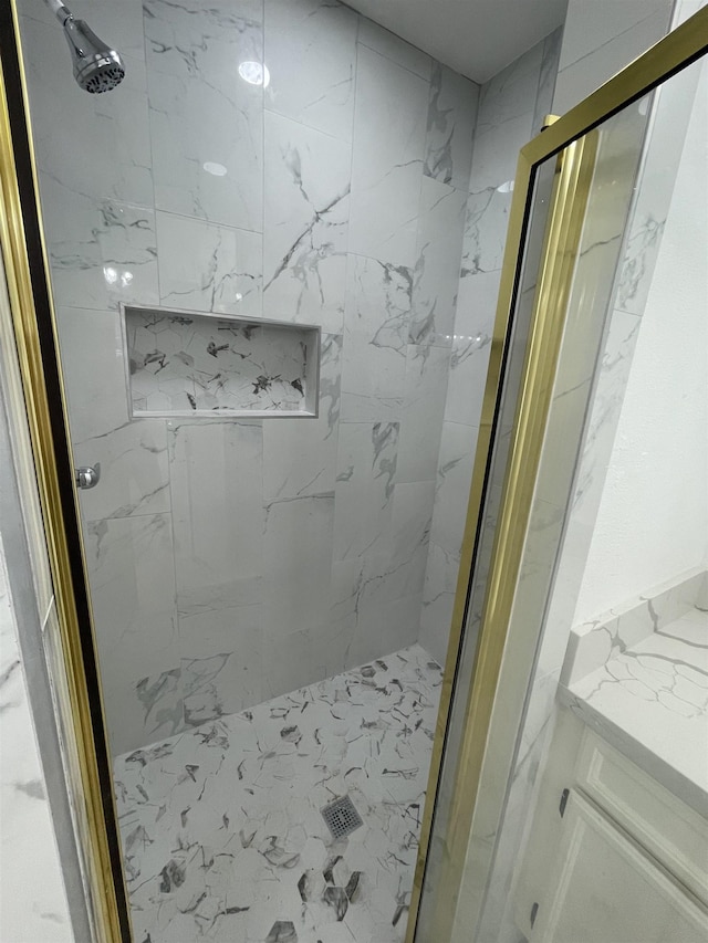 bathroom with a shower with shower door