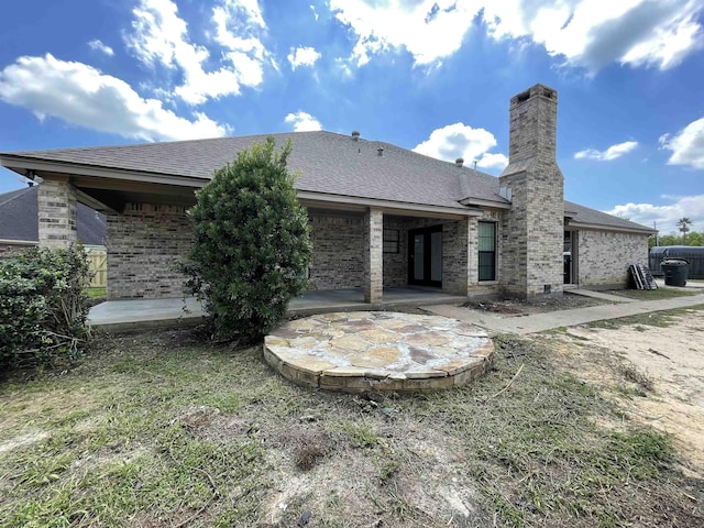 rear view of house featuring a patio