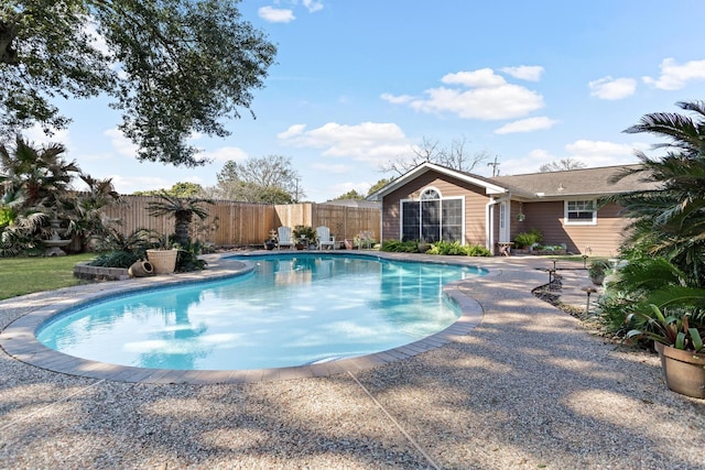 view of pool with a patio area, fence, and a fenced in pool