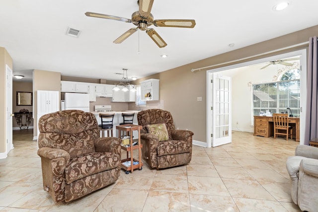 living area featuring a ceiling fan, recessed lighting, visible vents, and baseboards