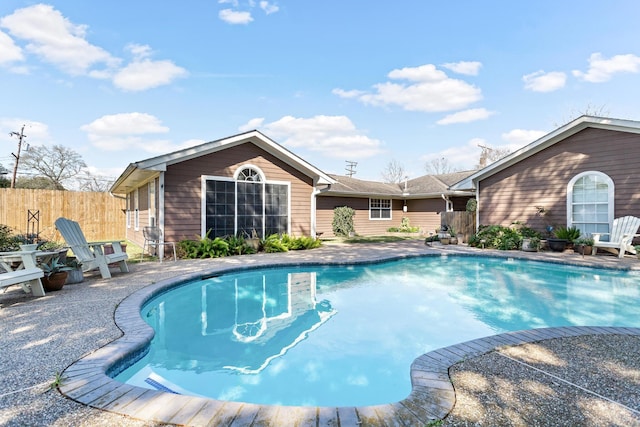 view of swimming pool with a fenced in pool, a patio area, and fence