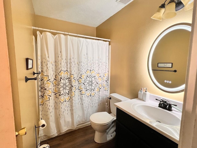 bathroom featuring vanity, a shower with curtain, toilet, a textured ceiling, and wood-type flooring